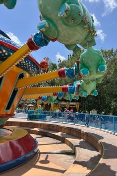 an amusement park ride with many colorful rides