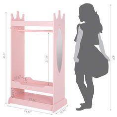 a girl is standing next to a pink shelf with a mirror on it and measurements