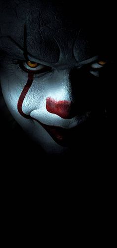 the evil clown from it's own movie, it looks like he is looking at something