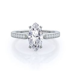 an oval cut diamond ring with channeled shoulders