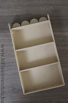 an empty wooden box sitting on top of a table