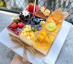 an assortment of fruits and desserts on display