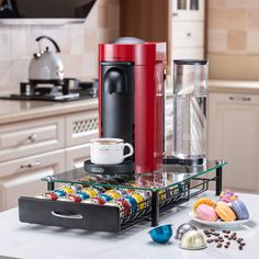 the kitchen counter is clean and ready to be used as a coffee maker or dessert bar