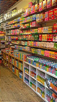 a store filled with lots of different types of food and drinks on shelves next to each other