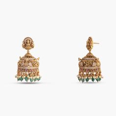 Description: Indulge in the epitome of elegance with our captivating antique gold-plated 925 silver jhumka earrings. Masterfully handcrafted, these earrings feature intricate peacock and floral motifs, dazzling Kempu stones, CZ stones, and bead drops. The stud part features the Goddess Lakshmi motif each detail reflects timeless luxury and charm. Product Information: Metal: 925 Silver with Antique Gold Plating Length: 5cm Stones: High Grade CZ Stones Findings: Push back Antique Gold Lakshmi Earrings, 22k Gold Bollywood Jhumkas With Peacock Design, 22k Gold Jhumkas With Peacock Design For Celebration, Yellow Gold Chandbali Jhumkas For Reception, Yellow Gold Jhumkas For Reception And Festivals, Bollywood Style Filigree Earrings For Festive Occasions, Festive Peacock Design Earrings For Reception, Ornate Chandbalis With Tilla For Diwali, Ornate Tilla Chandbalis For Diwali