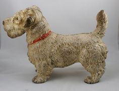 a statue of a dog with a red collar