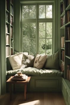 Sage green room ideas bedrooms featuring built-in window seat and floor-to-ceiling bookshelves