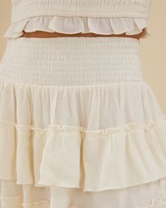 Featuring a smocked pull-on waistband, this mini skirt comes in lightweight, breathable crinkle fabric with ruffled tiers. Smocked waist Pull on style Tiered ruffle skirt Lightweight 80% Viscose 20% Nylon Hand wash in cool water. Do not bleach. Line dry in shade. Iron cool. The Smocked Ruffle Mini Skirt is styled with the Scooped Smocked Tank. Smocking, Rachel Parcell, Crinkle Fabric, Ruffle Mini Skirt, Tiered Ruffle Skirt, Ruffle Skirt, Skirt Pattern, Waist Skirt, Mini Skirt