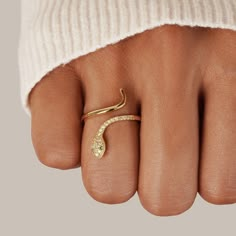 The beautiful snake symbolises rebirth, transformation, immortality, and healing. The serpent sheds its old skin for new, reminding us to be bold and embrace the unknown with courage and strength.  Gold plated, copper Cubic zirconia crystals Adjustable ring size - one size fits all Hypoallergenic, lead & nickel fre