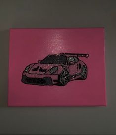 a pink painting with a car drawn on it