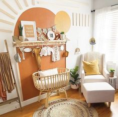 a living room filled with furniture and decor on top of a hard wood floored floor