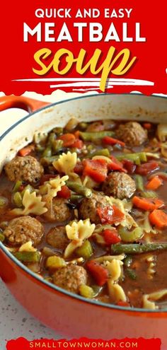 meatball soup with noodles and vegetables in a red pot