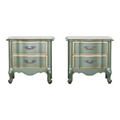 a pair of green and gold painted nightstands