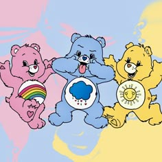 three teddy bears are standing next to each other and one is holding a rainbow ball