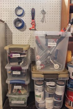 several storage bins with various tools in them