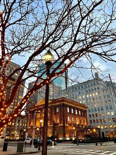 an old building is lit up with christmas lights