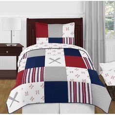 a baseball themed bed in a bedroom