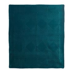 a teal blue quilted blanket on a white background