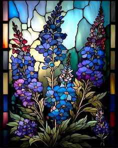 a stained glass window with blue flowers and green leaves in front of a sky background