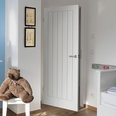 Cottage style white moulded panel interior door with grained effect.• White primed• Primed• 5-Panel• Moulded panel grained effect• Standard core construction Beige Hallway, Grey Internal Doors, Mdf Skirting, White Internal Doors, Fire Rated Doors, Panel Interior Doors, Room Divider Doors, Internal Door, Diy Plumbing