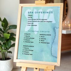 a wooden easel holding a spa offerings sign in front of a potted plant