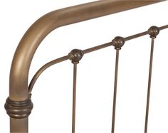 a metal bed frame with four posts and two knobs on the top one side