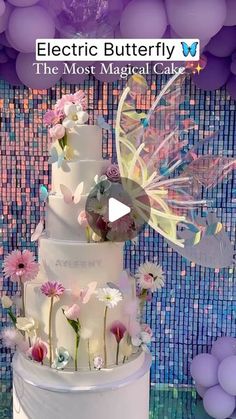 a wedding cake with flowers and butterflies on it