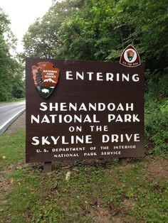 a sign for the entrance to shenandoah national park on the skyline drive