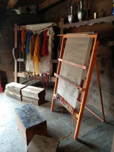 an old weaving studio with many different types of yarn