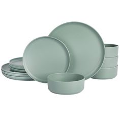 a set of grey dinnerware with plates and bowls on the bottom, in front of a white background