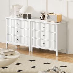 a white dresser sitting on top of a hard wood floor