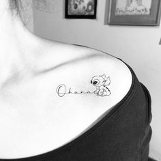 a woman with a tattoo on her shoulder that says, grandma in cursive writing