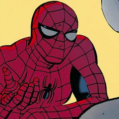 the spider - man is sitting down with his hands in his pockets and eyes closed