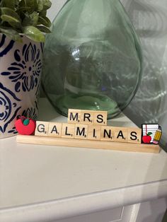 scrabble tiles spelling the word'mrs galaminas '