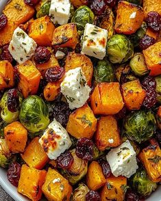 a white bowl filled with vegetables and cheese