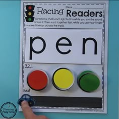 a close up of a person pointing to a sign with the word pen on it