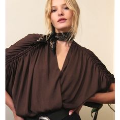 From Free People: Rachel's Silky Top Is All About Sexy Spring Style. The Deep V Neckline Is Round-Shaped At The Front And Gently Sloping At The Back, Leading To A Tie Sleeve Detail That Drapes Sexily Over The Upper Arms. This Boho Top Has A Relaxed Fit, So Be Sure To Wear With Your Favorite High-Waisted Short Or Skirt. Never Worn, Only Cut The Tags Off! White Crochet Blouse, Free People Kimono, White Peasant Blouse, Silky Top, Black Floral Blouse, Ruffle Bell Sleeve, Boho Tunic Tops, Balloon Sleeve Blouse, Silky Blouse