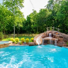 a pool with a waterfall in the middle