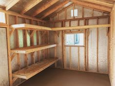 the inside of a building with shelves and windows on each side of the room that is being built