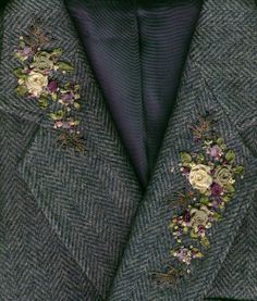 a suit jacket with flowers on the lapel