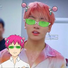 a man with pink hair and green glasses in front of a tv screen that has an anime character on it