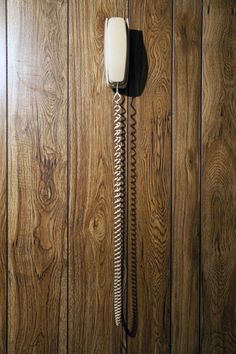 an old fashioned telephone on a wooden wall