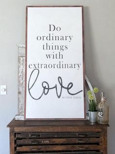 a sign that says do ordinary things with extraordinary love