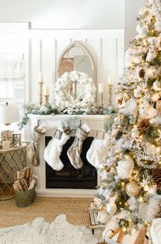 a decorated christmas tree in front of a fireplace