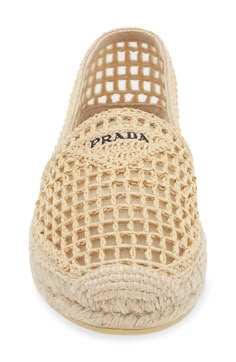 a pair of women's espadding shoes with woven fabric on the sole