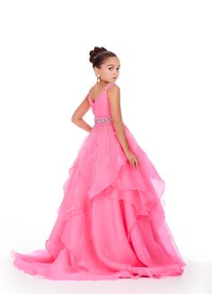 Elevate your little one's pageant look with the Ashley Lauren Kids 8219 Girls Layered Feather Pageant Dress. This stunning ballgown features a V-neck embellished with feathers, adding a touch of glamour to the overall design. With its layered skirt, this dress will make your child feel like a princess on stage. Be the star of the show in this fabulous organza ball gown. This dress features a v-neckline, beaded waistband and shoulder straps. The ruffled skirt has press-on stones and feathers comp V Neck Gown, Ashley Lauren, Ruffled Skirt, Pageant Dress, Layered Skirt, A Princess, On Stage, Ball Gown, Pink Girl