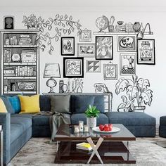 a living room with couches, tables and pictures on the wall behind them in black and white