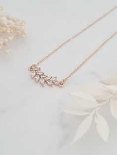 Pretty and dainty KC gold plated, CZ sparkly crystal leaf pendant necklaces. Each pendant has 10 leaves and measures 2.5cm in length. The pendant hangs on a gold plated fine chain. Necklaces and bracelets where possible will arrive on a card and in an organza bag, please see last pictures as examples. Dainty Gold Rhinestone Necklace For Wedding, Dainty Gold Rhinestone Wedding Necklace, Leaf Jewellery, Jewellery Crystal, Leaf Jewelry, Bridesmaid Necklace, Chain Necklaces, Leaf Necklace, Leaf Pendant