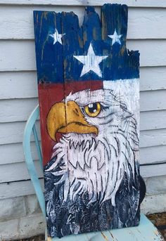 an american eagle painted on a wooden sign