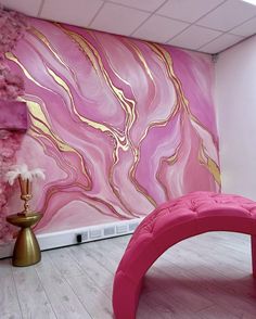 a pink and gold painted wall in a room